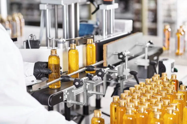 Plastic bottles on a liquid filling line