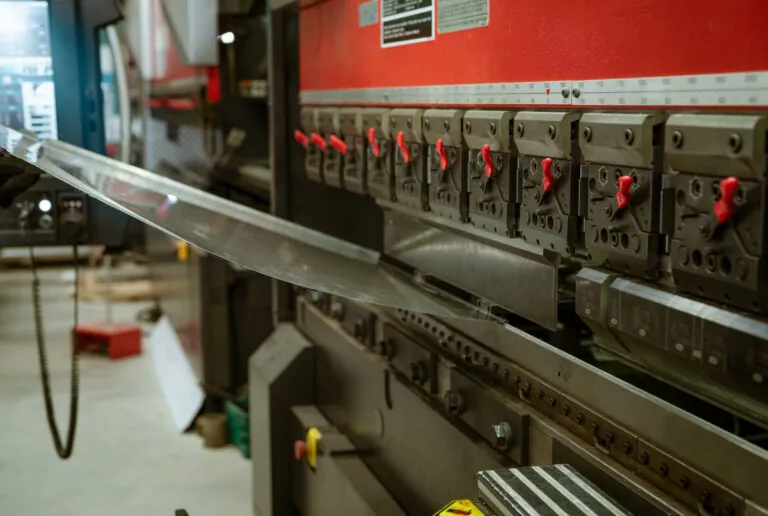 CNC press brake bending a metal panel