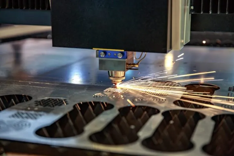 Stainless steel sheet being cut with a laser